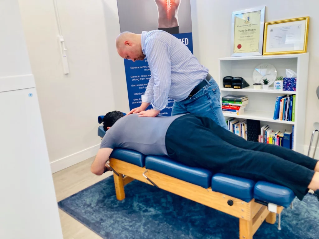 Chiropractor Xander Van Der Walt Treating Back Pain